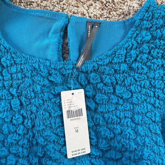 Anthropologie sinched Teal Textured Sleeveless Mini Dress tight at the bottom - Picture 5 of 12